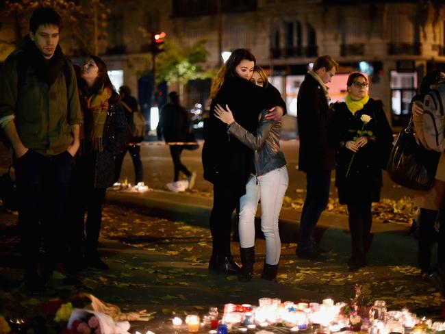 Mourners gather outside the Bataclan concert hall, the scene of the worst atrocity of the Paris attacks, to lay flowers. (Photo by Jeff J Mitchell/Getty Images)