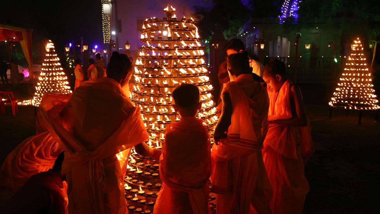 Students from a Hindu religious school light earthen lamps to mark Diwali in Varanasi, India, on October 31, 2024. Picture: Niharika Kulkarni/AFP