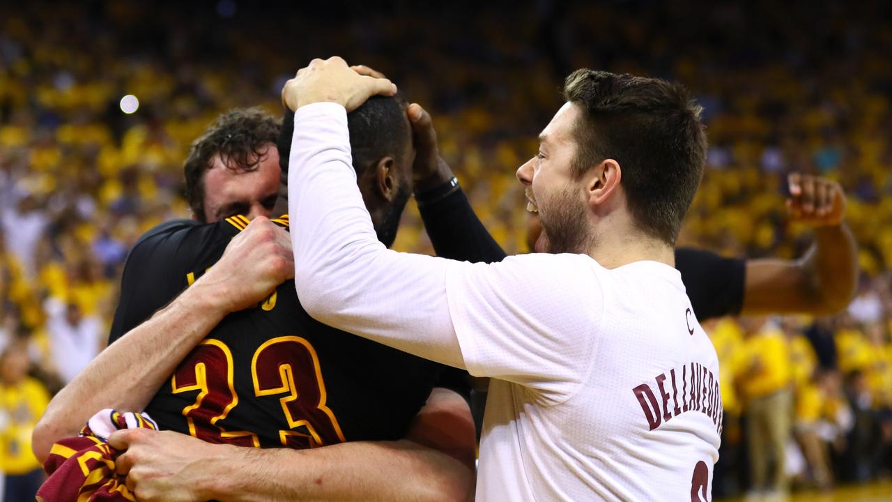 OAKLAND, CA - JUNE 19: LeBron James #23, Matthew Dellavedova #8 and Kevin Love #0 of the Cleveland Cavaliers celebrate after defeating the Golden State Warriors 93-89 in Game 7 of the 2016 NBA Finals at ORACLE Arena on June 19, 2016 in Oakland, California. NOTE TO USER: User expressly acknowledges and agrees that, by downloading and or using this photograph, User is consenting to the terms and conditions of the Getty Images License Agreement. Ezra Shaw/Getty Images/AFP == FOR NEWSPAPERS, INTERNET, TELCOS &amp; TELEVISION USE ONLY ==