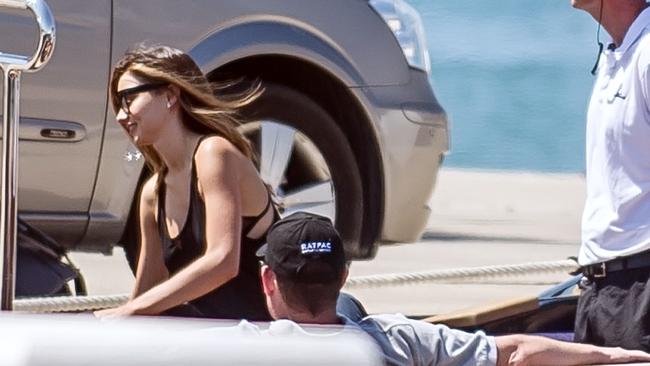Romantic getaway ... Miranda Kerr is all smiles as she greets rumoured boyfriend James Packer on board a boat, which took the pair to his waiting luxury super yacht. Picture: Splash News