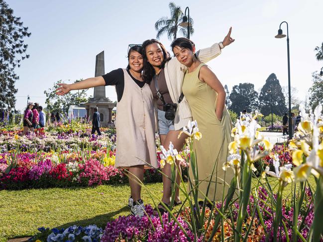 Visiting from Brisbane are (from left) Charmaine Fernandez, Zy Maglaqui and Verelyn Ogbac in Queens Park for Carnival of Flowers, Saturday, September 21, 2024. Picture: Kevin Farmer