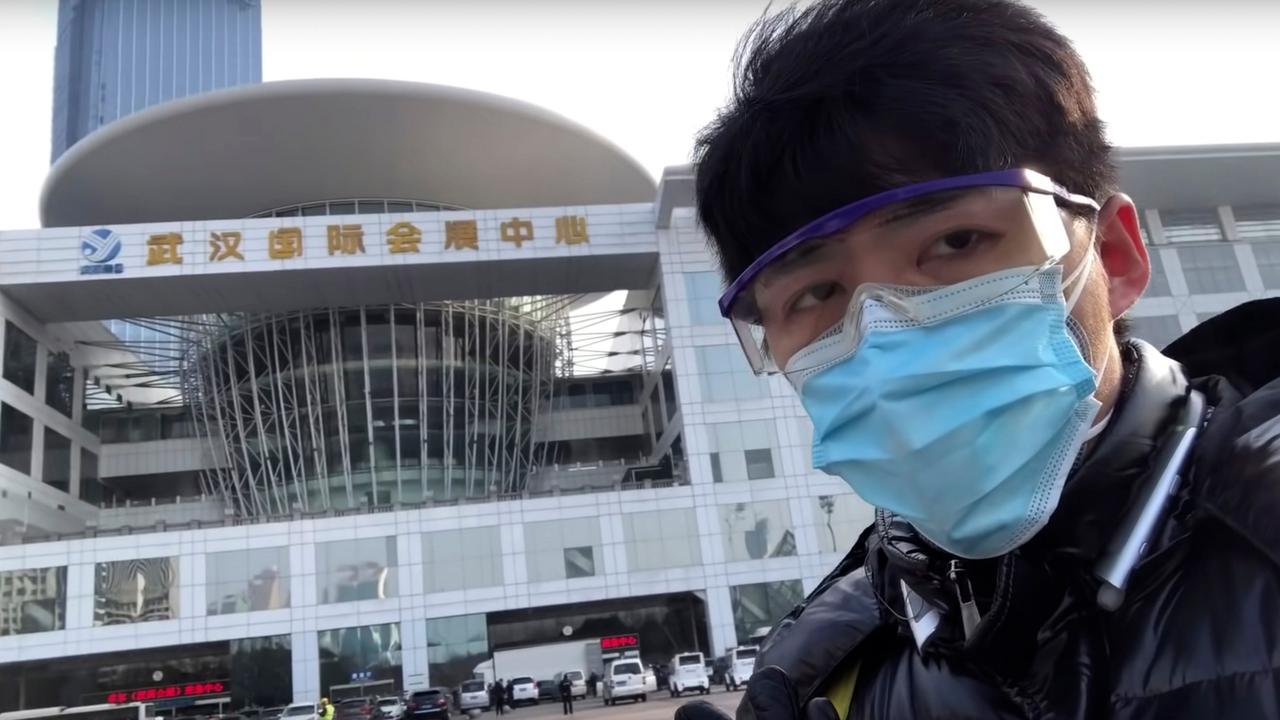 Chinese citizen journalist Chen Qiushi speaks in front of a convention centre-turned makeshift hospital in Wuhan before his disappearance. Picture: Chen Qiushi via AP