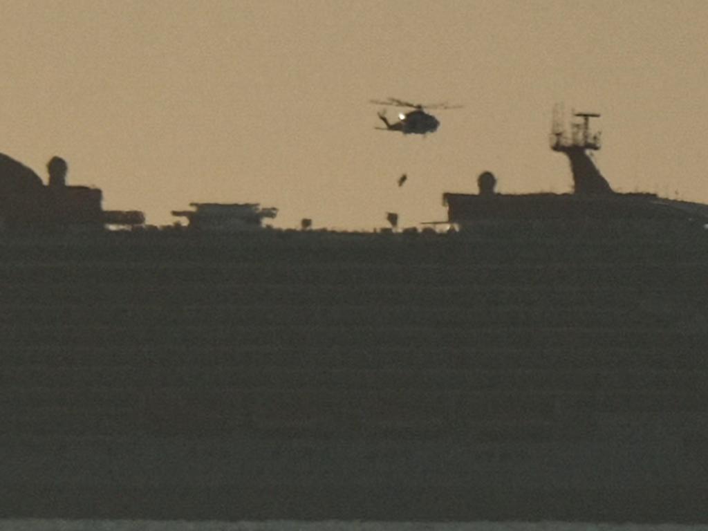 The air ambulance lowers its winch above the ship’s deck. Picture: Shaun Viljoen.