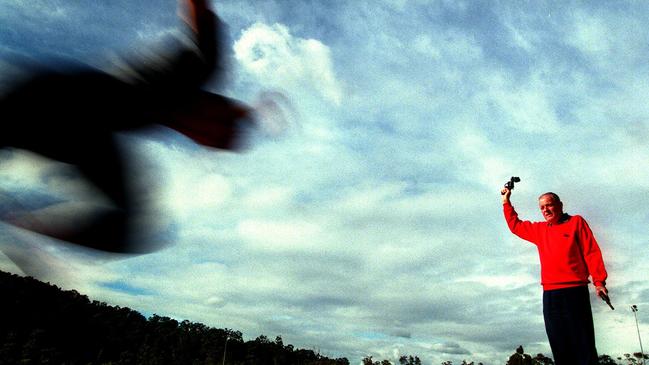 Mr Martin, pictured in May 2000, during a training session with athlete Matt Shirvington after it was announced he would start the 100m at the 2000 games. Picture: Phil Hillyard