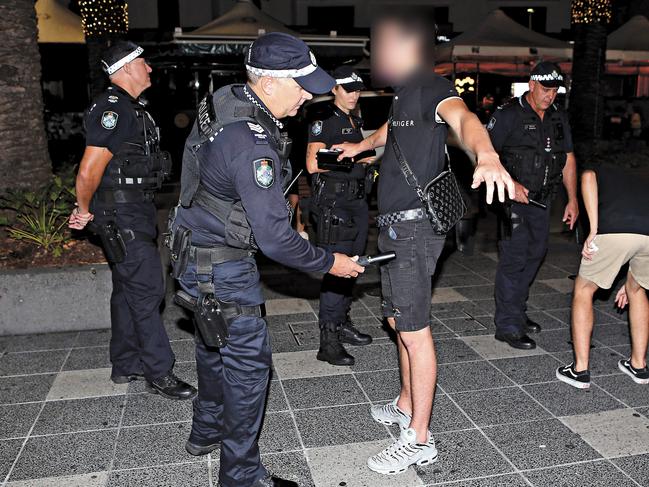 Police wanding revellers for knives in Surfers Paradise. Picture: Richard Gosling.