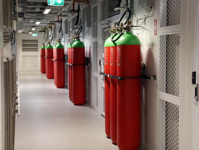 A corridor lined with gas cylinders installed to suppress fires at the Government Data Centre in Silverwater today. Picture: Tim Hunter