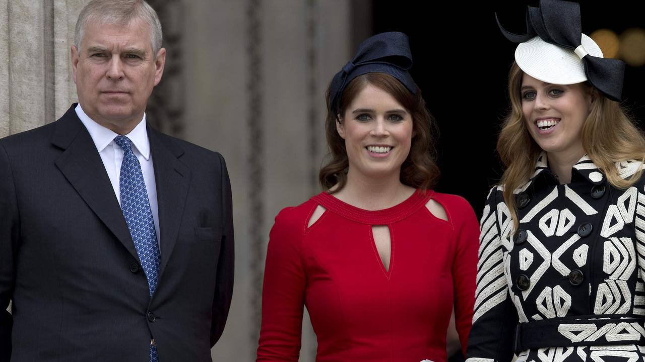 Prince Andrew with his daughters Eugenie and Beatrice. Picture: Justin Tallis/AFP