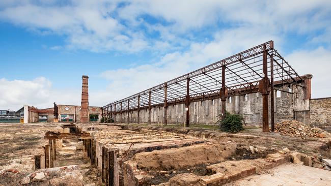 Heritage structures at the former Brompton gasworks site, including the Retort House, its chimney and the bluestone wall on Chief St. Picture: Renewal SA