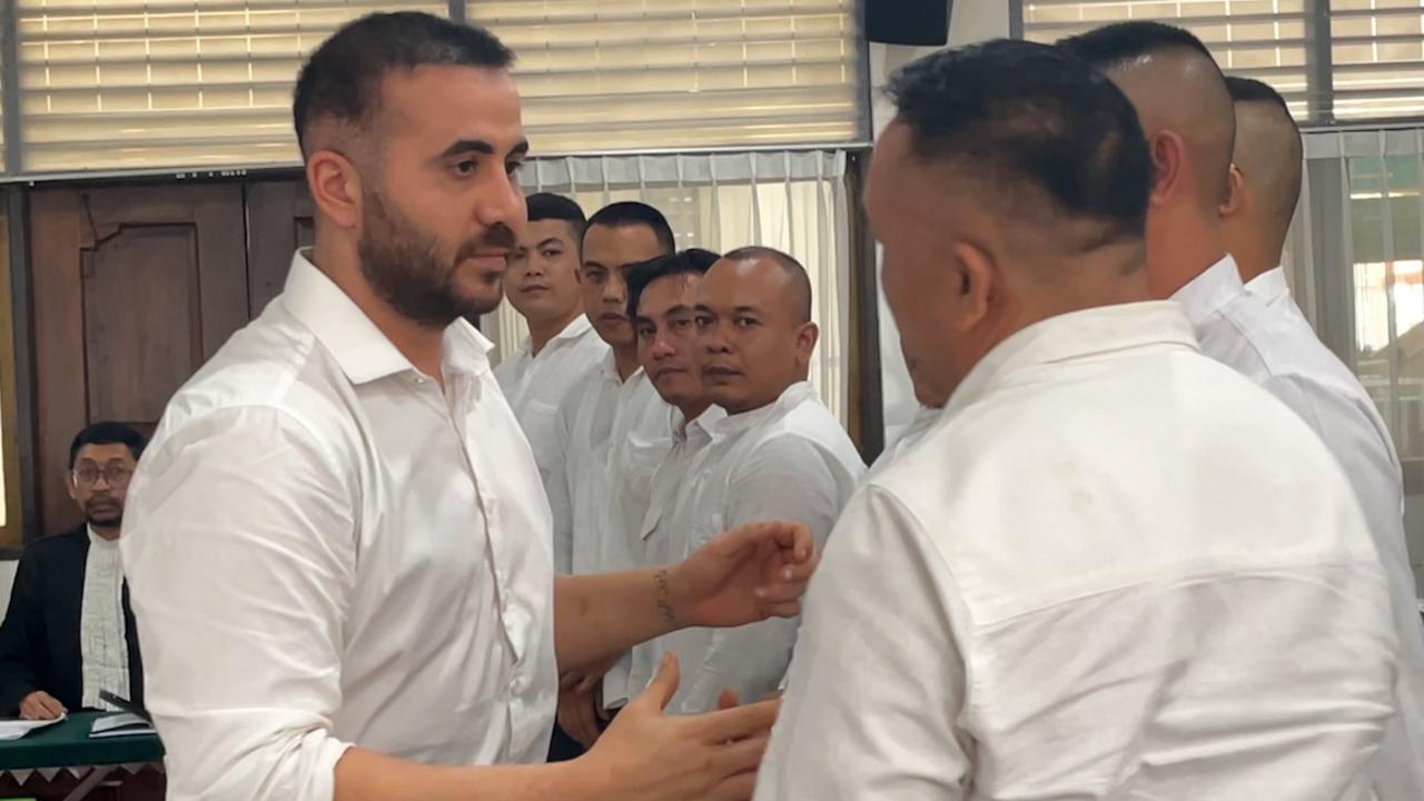 The men all shook hands and hugged after Mr Rifai gave his testimony. Picture: Komang Erviani