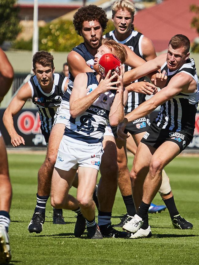 South's Nick Liddle followed by Port's Matthew Appleton during the sides’ clash at Alberton Oval on Saturday. Picture: Matt Loxton