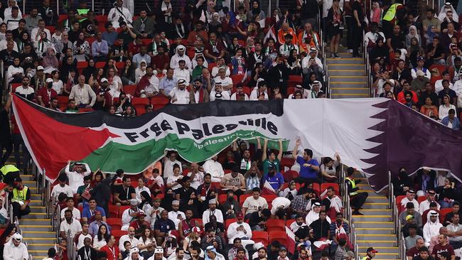 Fans hold up a banner reading "Free Palestine" during the FIFA World Cup Qatar 2022 Group A match between Netherlands and Qatar. Picture: Catherine Ivill/Getty Images