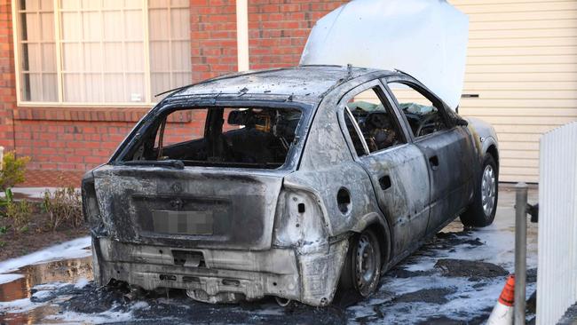 A car has been torched at a home in Adelaide’s western suburbs this morning. Picture: AAP/Mark Brake