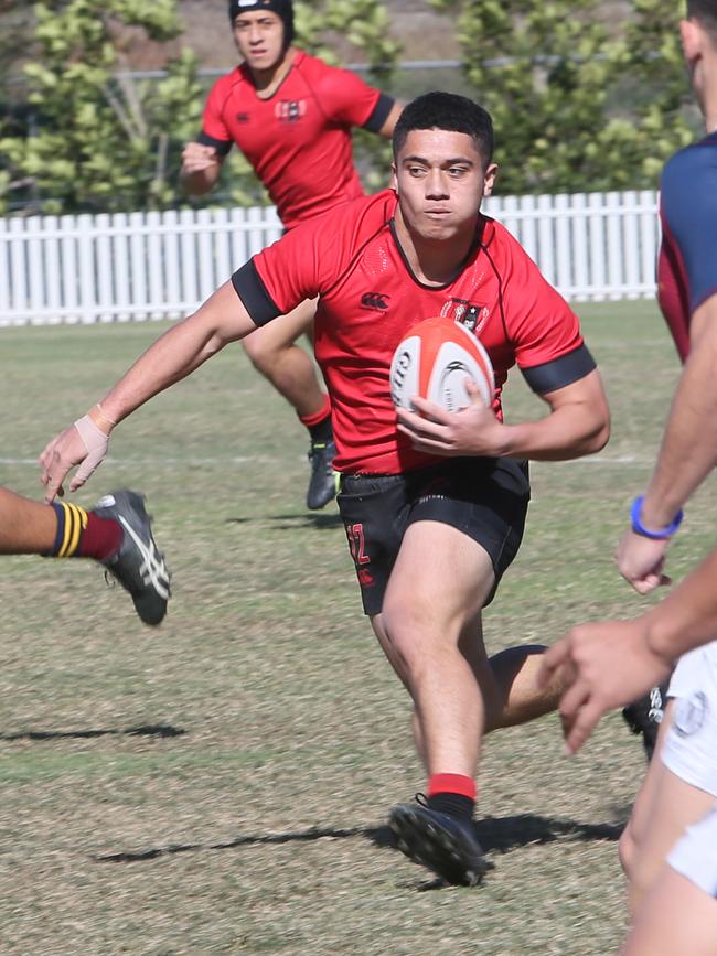 Gregory Terrace centre David Vaihu steps through the Brisbane State High defence. Picture: AAP/Richard Waugh