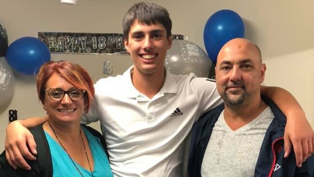 Christopher Cassaniti, pictured with his parents at his 18th birthday, died after scaffolding collapsed on top of him at a building site he was working at. Picture: Facebook