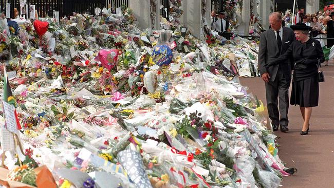 The Duke of Edinburgh and Queen Elizabeth view the thousands of flowers and tributes left outside Kensington Palace in memory of Diana, Princess of Wales.