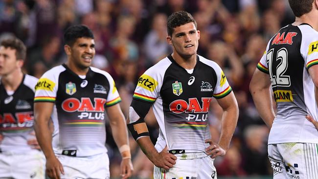 Panthers players cut dejected figures after their loss to the Broncos.