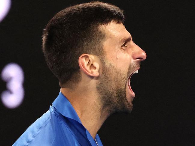 Serbia's Novak Djokovic celebrates a match point against Australia's Alexei Popyrin during their men's singles match on day four of the Australian Open tennis tournament in Melbourne on January 17, 2024. (Photo by David GRAY / AFP) / -- IMAGE RESTRICTED TO EDITORIAL USE - STRICTLY NO COMMERCIAL USE --