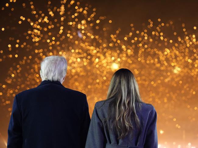 US President-elect Donald Trump and his wife Melania Trump watch fireworks during a reception in his honor at Trump National Golf Club Washington DC in Sterling, Virginia, on January 18, 2025. (Photo by Alex Brandon / POOL / AFP)