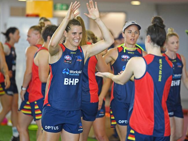 Crows co-captain Chelsea Randall is pictured giving double-high-fives to teammate Eloise Sheridan at the Crows first AFLW pre-season training session at West Lakes on Monday evening. Picture: Tom Huntley