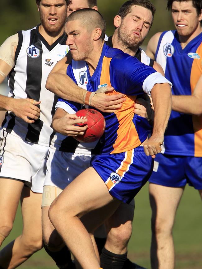 Nick Lynch playing football for Macleod.