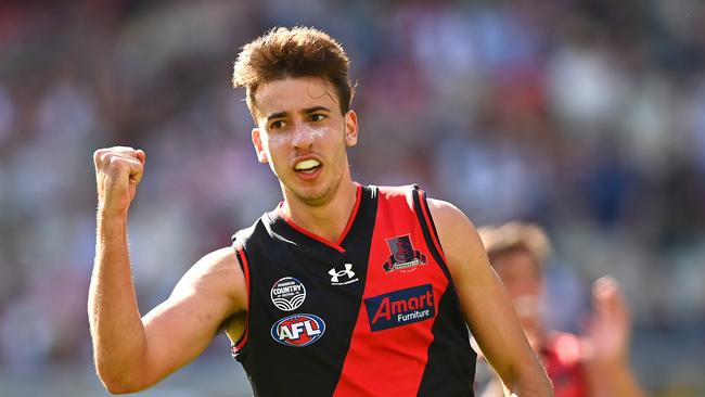 MELBOURNE, AUSTRALIA – MARCH 19: Nic Martin of the Bombers celebrates kicking a goal during the round one AFL match between the Geelong Cats and the Essendon Bombers at Melbourne Cricket Ground on March 19, 2022 in Melbourne, Australia. (Photo by Quinn Rooney/Getty Images)