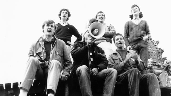 A young Anthony Albanese (L), leads students in a protest atop the University of Sydney clock tower.