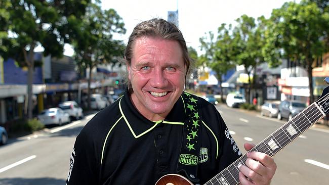 Will Nambour develop as a centre for music with plans to locate USC's Communication and Creative Arts School in the town and potentially at the council chambers.Mark Higgins from Shake It Up Music rocking out in Nambour's main street.