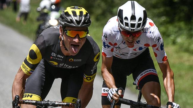 France's Thomas Voeckler (L) and France's Warren Barguil wearing the best climber's polka dot jersey ride in a breakaway during the 101km thirteenth stage.