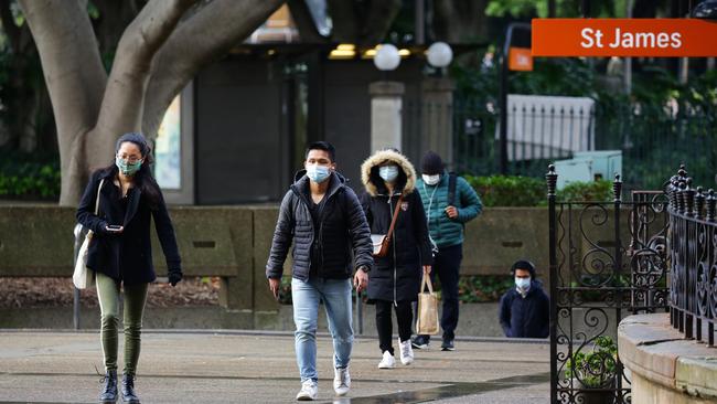 Commuters in Sydney’s CBD. With borders now closed for more than a year, the impact is becoming more pronounced in other areas less evident, including white collar sectors. Picture: NCA NewsWire/Gaye Gerard