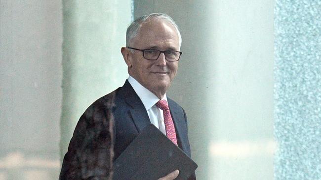 Prime Minister Malcolm Turnbull arrives at a party room meeting at Parliament House in Canberra, Tuesday, August 21, 2018. (AAP Image/Mick Tsikas)