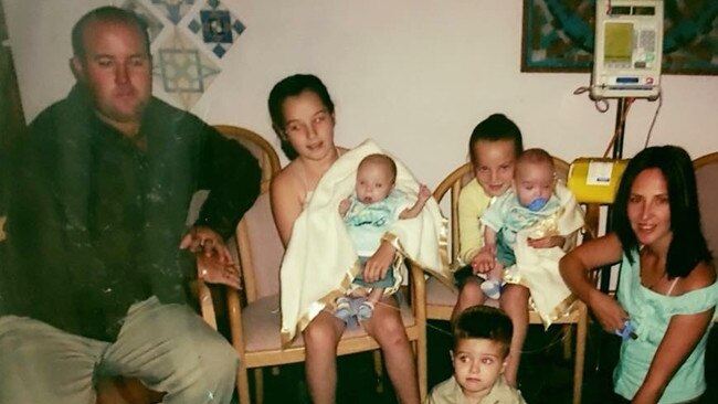 The Giles family with the twin when they were babies. 