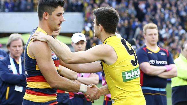 Taylor Walker and Trent Cotchin shake hands after the match. Picture: Sarah Reed