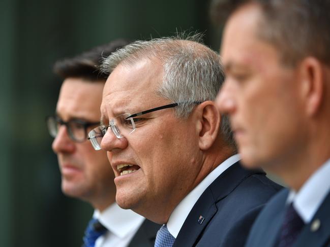 Water Resources Minister David Littleproud, Prime Minister Scott Morrison and National Bushfire Recovery Agency chief Andrew Colvin at a press conference at Parliament House today. Picture: Mick Tsikas/AAP