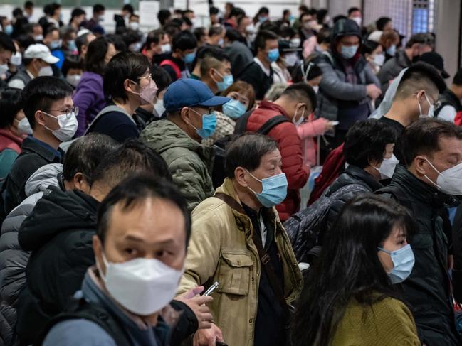Travellers wait at the Lok Ma Chau border checkpoint in Hong Kong, China. Tens of thousands cross Hong Kong-mainland China border as Covid zero ends after 3 years of restrictions. Picture: Anthony Kwan/Getty Images