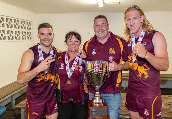 L-R: Tyler Cornish, Anne Cornish, Mark Cornish and Jon Croad who is one of the boys the Cornish's billeted, with the 2018 QAFL premiership cup. Picture supplied.