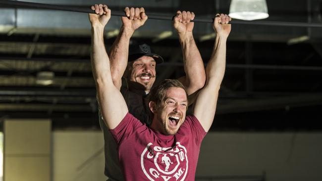 Gold's Gym Toowoomba franchise owners Joe Sorbara (left) and Bevin Jones do pull-ups on a beam in the former Aldi Clifford Gardens that they are converting into a Gold's Gym. Picture: Kevin Farmer