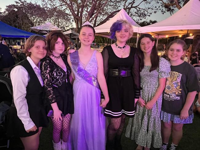 Isobel McInnes, Nikki Lawrence, 2022 Junior Queen Ella Roach, Lilly Stoddard, Sara Wallace and Charlotte Fawkes (left to right) at the 2022 Grafton Jacaranda crowning.