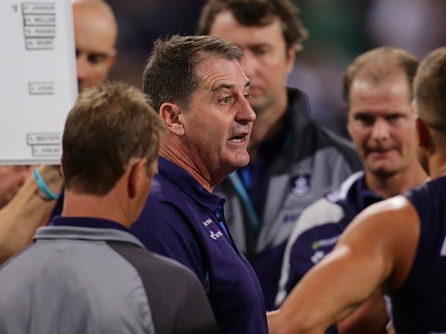 PERTH, WESTERN AUSTRALIA - APRIL 08:  Dockers coach Ross Lyon addresses the players at the quarter time break during the round three AFL match between the Fremantle Dockers and the Western Bulldogs at Domain Stadium on April 8, 2017 in Perth, Australia.  (Photo by Will Russell/AFL Media/Getty Images)