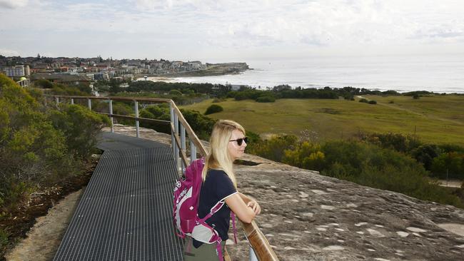 Lauren Hockey checks out the view on the Malabar to South Maroubra walking track, which opened in February. Randwick Council has set aside funds in the budget to develop more coastal walkways. Picture: John Appleyard