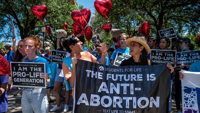 Pro-life protesters stand near the gate of the Texas state capitol. Picture: AFP