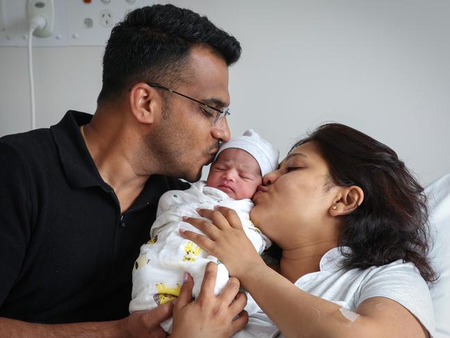 Vivek Menon and Apoorva Mali with baby daughter Miraya. Picture: David Caird