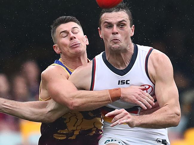 BRISBANE, AUSTRALIA - JUNE 28: Dayne Zorko of the Lions tackles Brad Crouch of the Crows during the round 4 AFL match between the Brisbane Lions and the Adelaide Crows at The Gabba on June 28, 2020 in Brisbane, Australia. (Photo by Jono Searle/AFL Photos/via Getty Images )