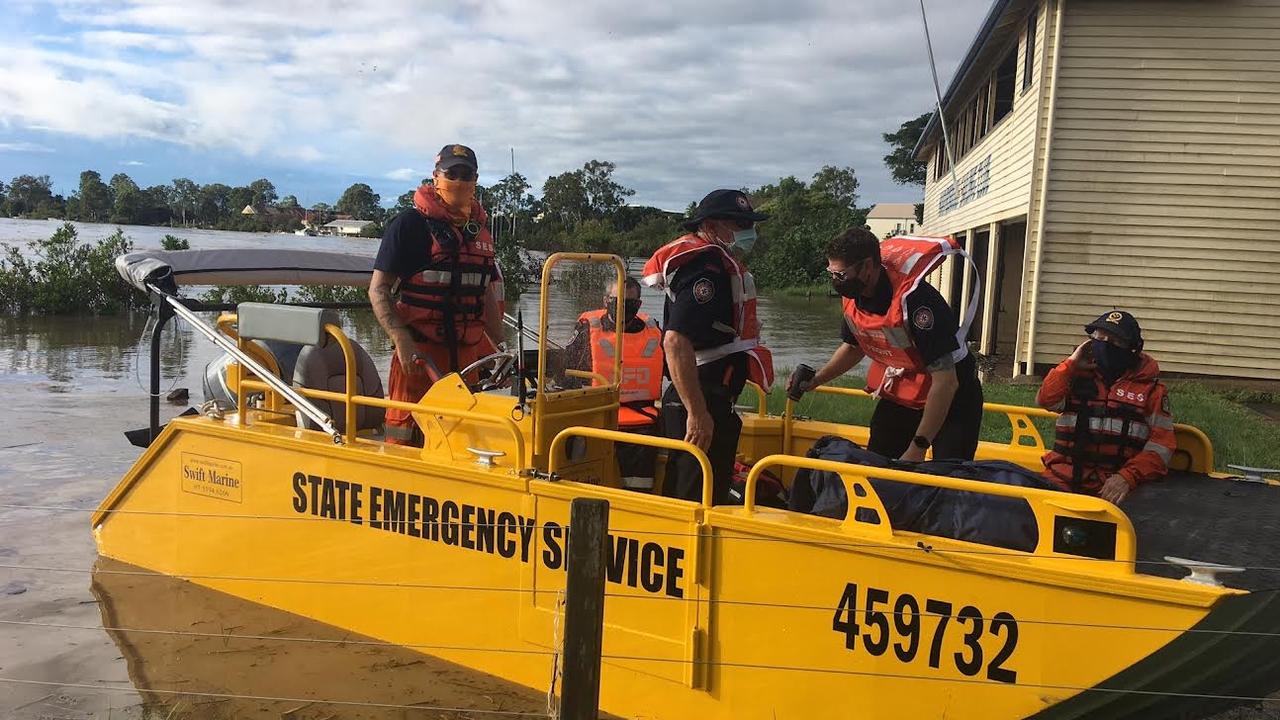 SES boat on its way to Granville, which has been isolated by the floods.