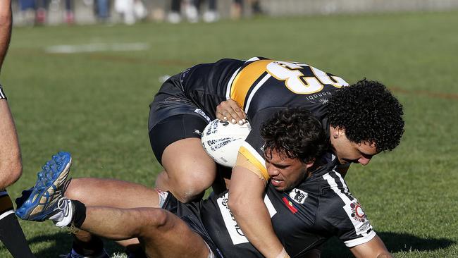 Matraville's Jaxon Petterson tackles Redfern's Matthew Gordon. Picture: John Appleyard