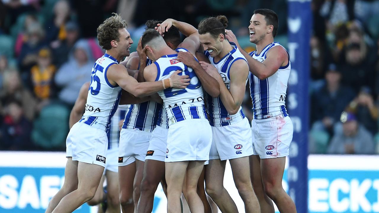 North Melbourne players celebrate a Tarryn Thomas goal. Picture: Steve Bell/Getty Images