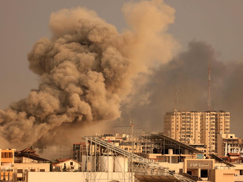 Smoke billows behind highrise buildings during an Israeli airstrike on Gaza City on October 9, 2023. Picture: AFP