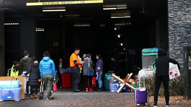 Residents leaving the evacuated Mascot Towers in June. Picture: Jane Dempster