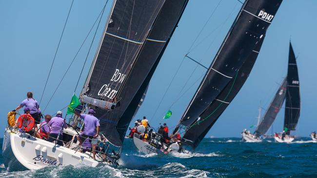 Bowline and Advantedge pass between North and South Head at the start of the 2024 Rolex Sydney to Hobart yacht race. Picture: Justin Lloyd.