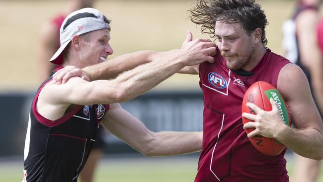 Jack Steven fends of Nick Hind during training. Picture: Michael Klein