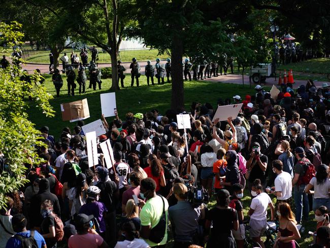 Secret Service look on as demonstrators protest the death of George Floyd, near the White House. Picture: AFP